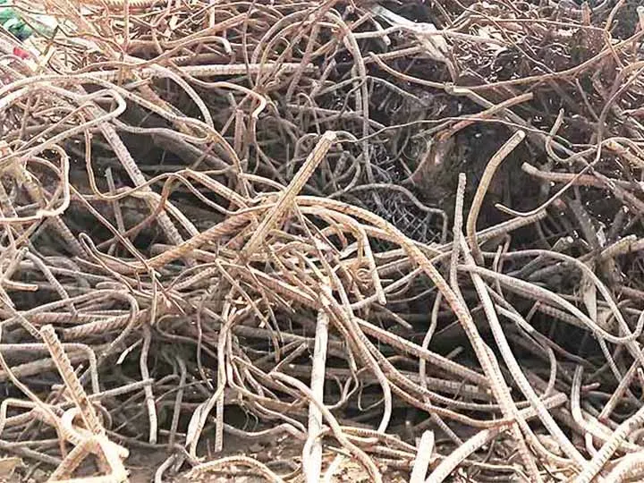 Pile of bent, rusted reinforcing bars ready for scrap recycling